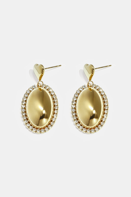 Statement oorbellen met ovale charm omringd met steentjes